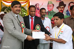 eo ttd presenting silver dollor and certificate of apprecitation to Sri KM Mannivannam Jr Asst JEO office Tml