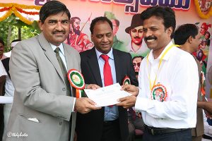 eo ttd presenting silver dollor and certificate of apprecitation to Sri Sesha Reddy GM Transport