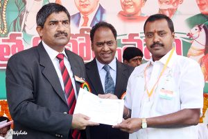 EO presenting Certification of appreciation to Sri Dharmaih Pat Suptd