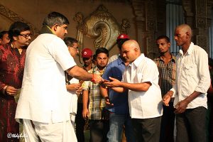 eo ttd distributing the cds to devotees