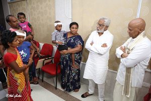 CHAIRMAN INTERACTING WITH COCHLEAR IMPLANT OPERATION CHILD2