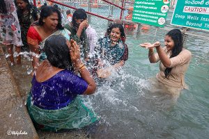 DEVOTEES TAKING A DIP DEVOTEES TAKING A DIP